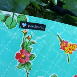 Forkl�de i mint gr�n voksdug med blomster