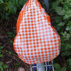cykelsadelovetrk i orange voksdug