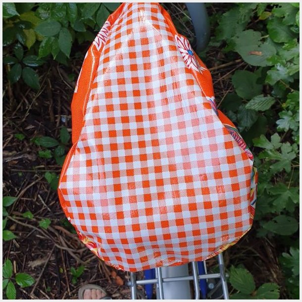 cykelsadelovetrk i orange voksdug