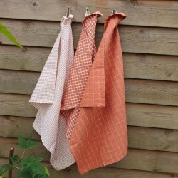 lkre viskestykker i rust og orange nuancer