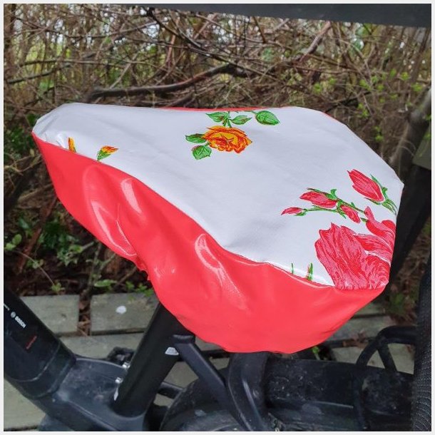 Cykelsadelovertr�k i Voksdug Margit Hvid Blomst og R�d Kant