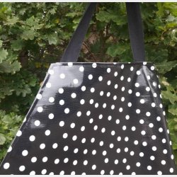 Forklde i Sort Voksdug med Lysgr Prikker