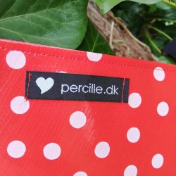 Forklde i voksdug rd med prikker