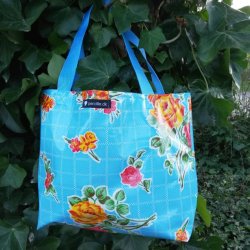 Taske mini i voksdug i lysebl nuancer